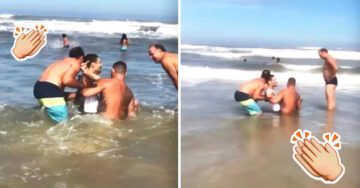 Extraños ayudan a un papá para que su hijo en silla de ruedas entre al mar por primera vez