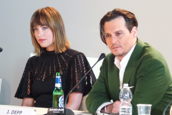 Dakota Johnson and Johnny Depp at the press conference for the movie Criminal Agreement, at the 72nd edition of the Venice Film Festival held in 2015.