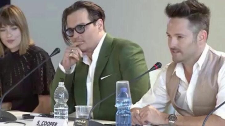 Dakota Johnson next to actor Johnny Depp during a press conference in 2015